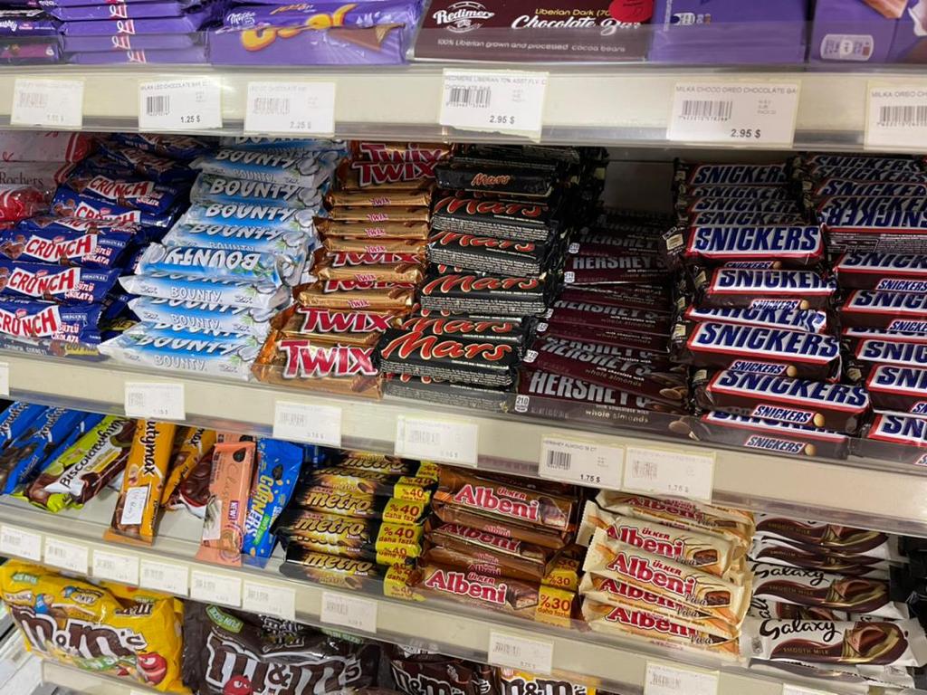 Mars, Twix, Bounty and other confectionery products arranged on retail shelves